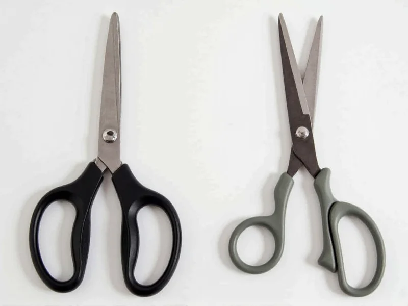 Close-up comparison of precision crafting scissors versus standard household scissors