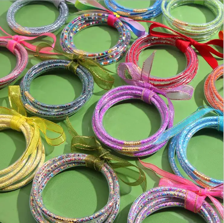 

All Weather Bangles Stack Silicone Plastic Glitter Jelly Bracelet Powder Bowknot Friendship Glitter Bangles Gold for Women 50pcs, Picture