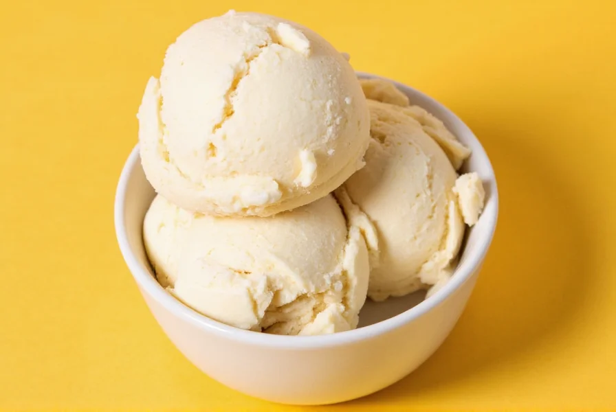 Close-up of artisanal ginger ice cream showing creamy texture with visible ginger pieces in a vintage bowl
