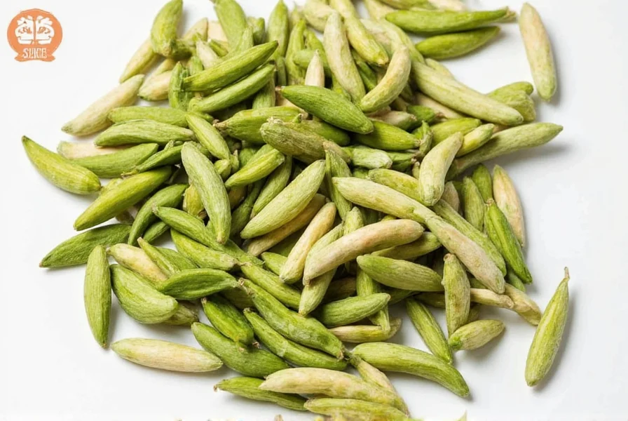 Close-up view of green cardamom pods showing their distinctive triangular shape and rich color
