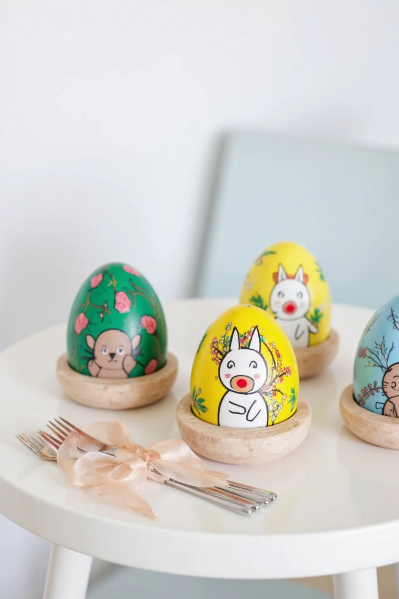 A variety of decorated Easter eggs displayed in a basket