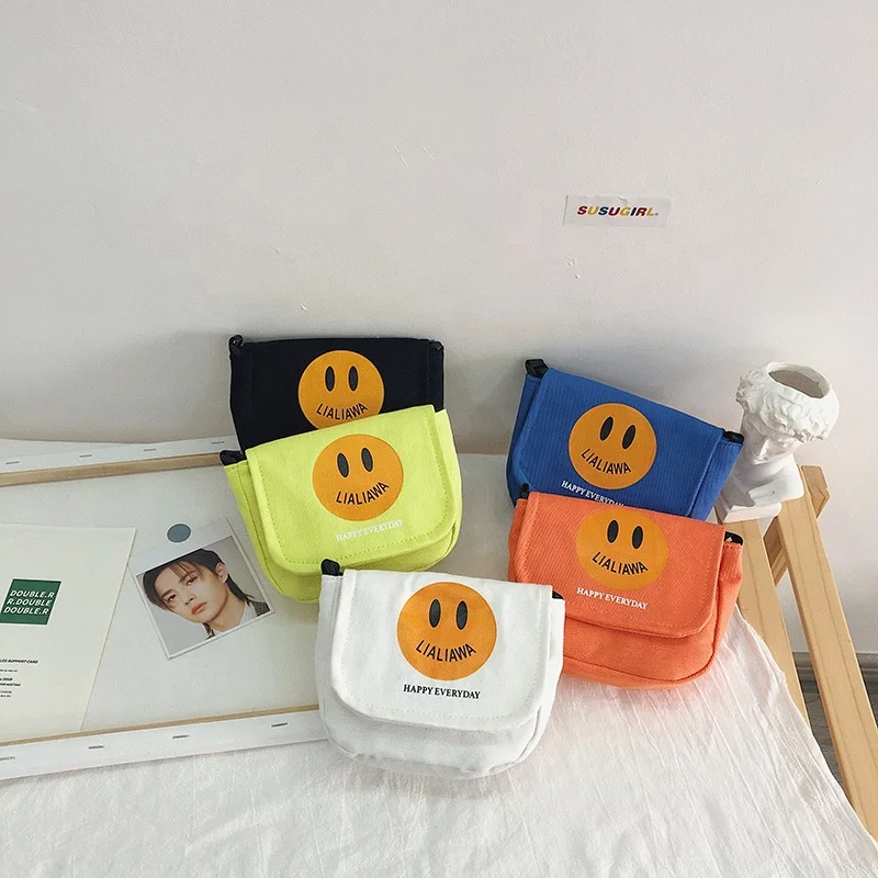 

Fashion Korean version small bag color contrast smiling face children boys and girls fluorescent canvas cross carrying small clo, Picture