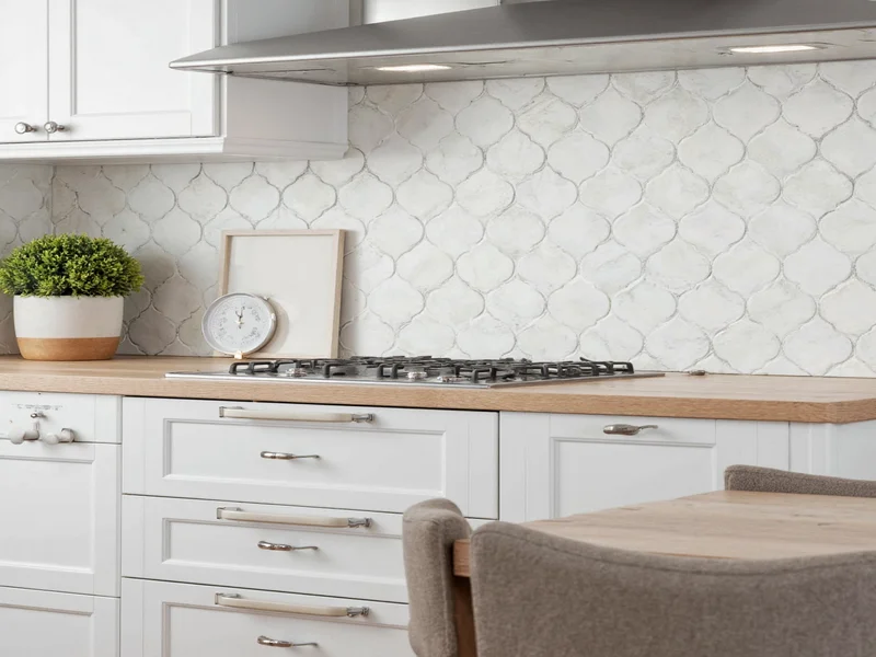 DIY kitchen backsplash installation with geometric tiles