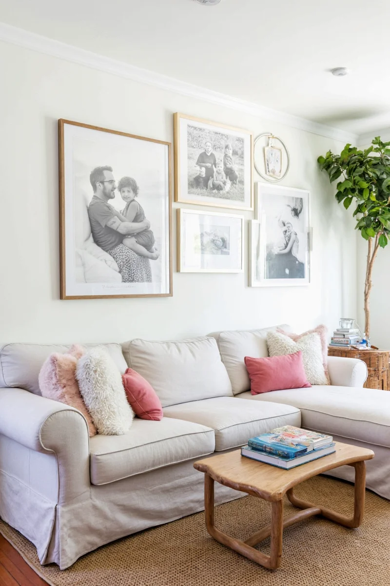 DIY living room photo wall with kids' artwork and family photos