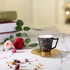 Amber Irregular gold-plated line design porcelain ware coffee cup with aluminum saucer and aluminum bottle