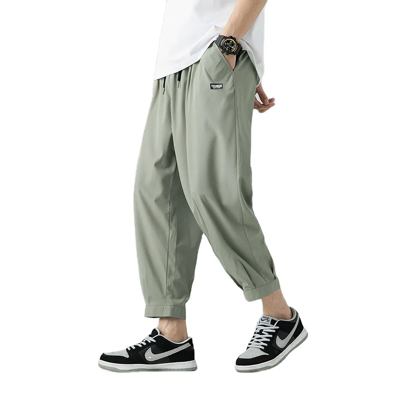 

Summer hot selling men's loose fit jogger pants relaxed trousers reflective printing cargo baggy pants