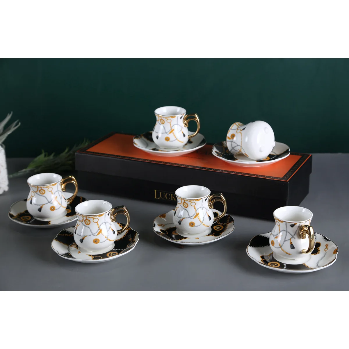 

Exquisite Middle Eastern type mini three-legged coffee cup and saucer gift box