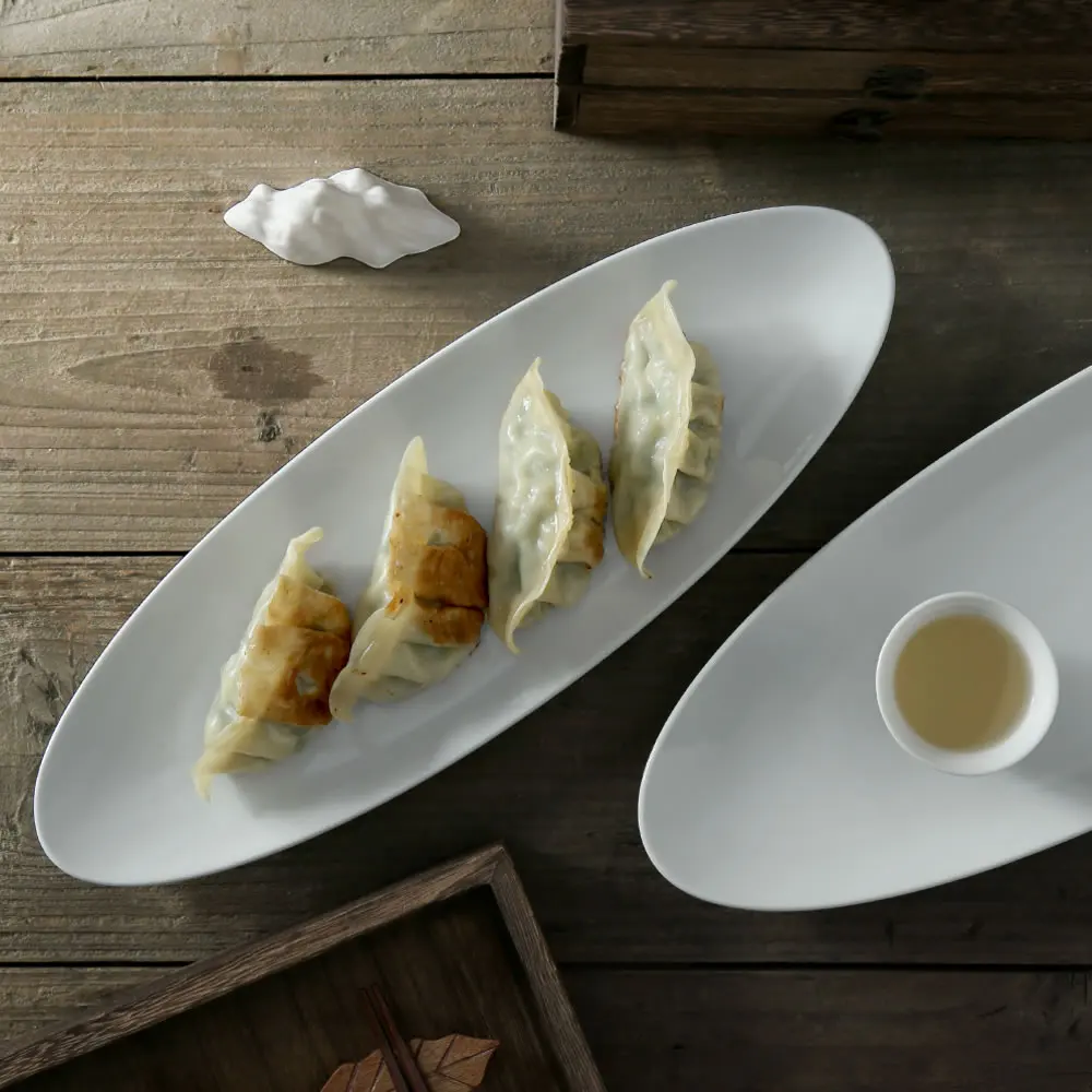 

Factory Wholesale Japanese Bulk Ceramic Sushi Serving Boat Plates Porcelain Fish Dinner Plate For Restaurant Catering