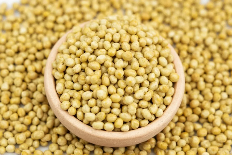 Close-up photograph of golden fenugreek seeds scattered on wooden cutting board with fresh fenugreek leaves