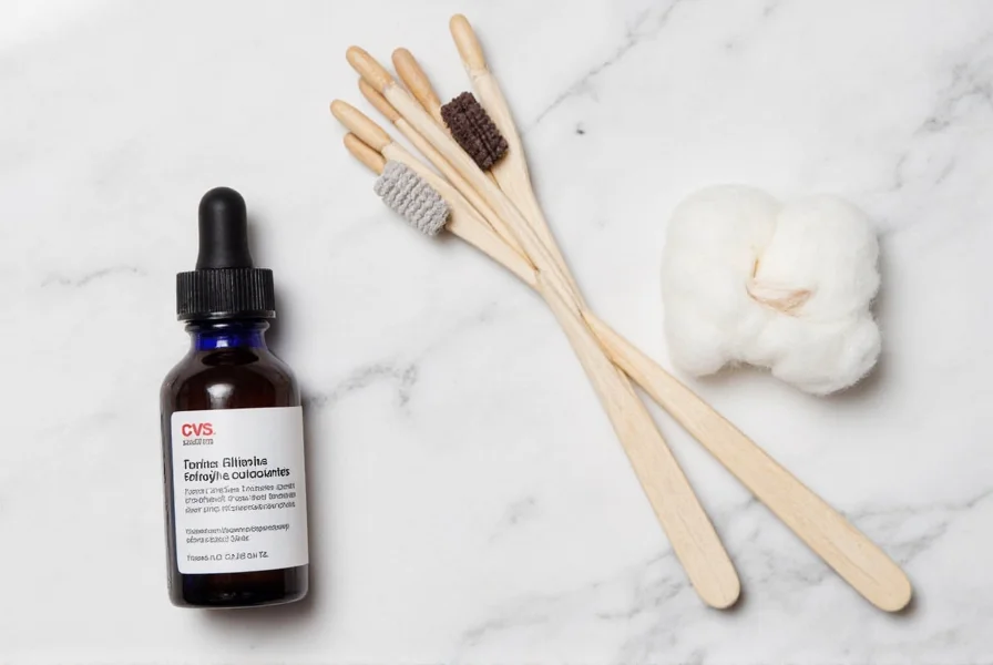 CVS clove oil bottle next to cotton swabs and carrier oil for dental application