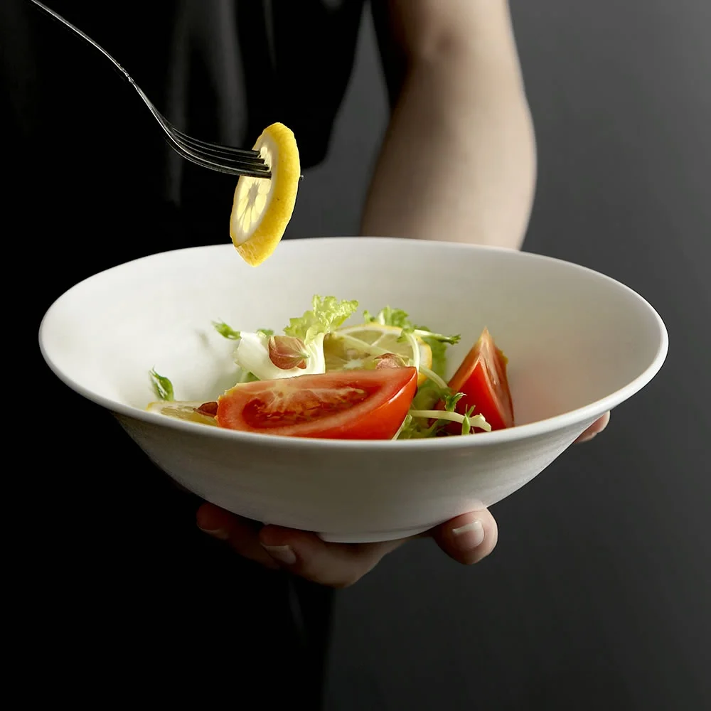 

Factory Direct Wholesale Nordic Style Crystal White Ceramic Microwave Soup Bowls Irregular Porcelain Fruit Salad Bowl