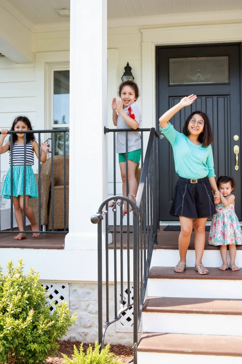 Family enjoying a porch with stylish yet safe exterior railing