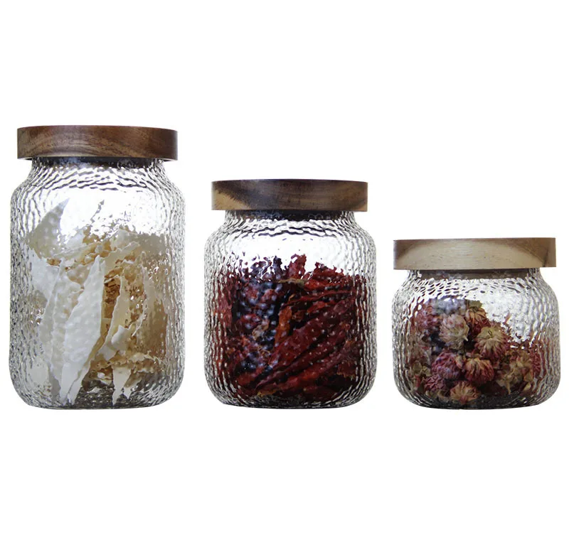 

Supplier Popular 400/500/900ml Hammered Borosilicate Glass Storage Jar with Wooden Lid, Customized color