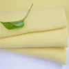 Hot sale soft brushed light yellow polyester pile knit solid color fabric lycra