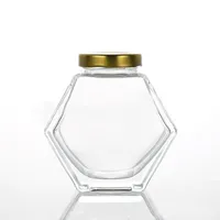 

Wholesale six sides flat hexagon empty clear 100ml 180ml 280ml 380ml glass bee honey jars with metal lid
