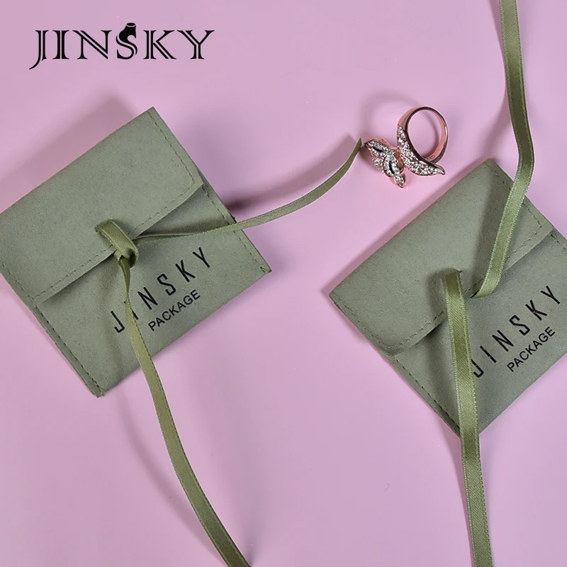 

JINSKY luxury deerskin velvet jewelry packaging pouch with logo high-end green jewelry bag with ribbon