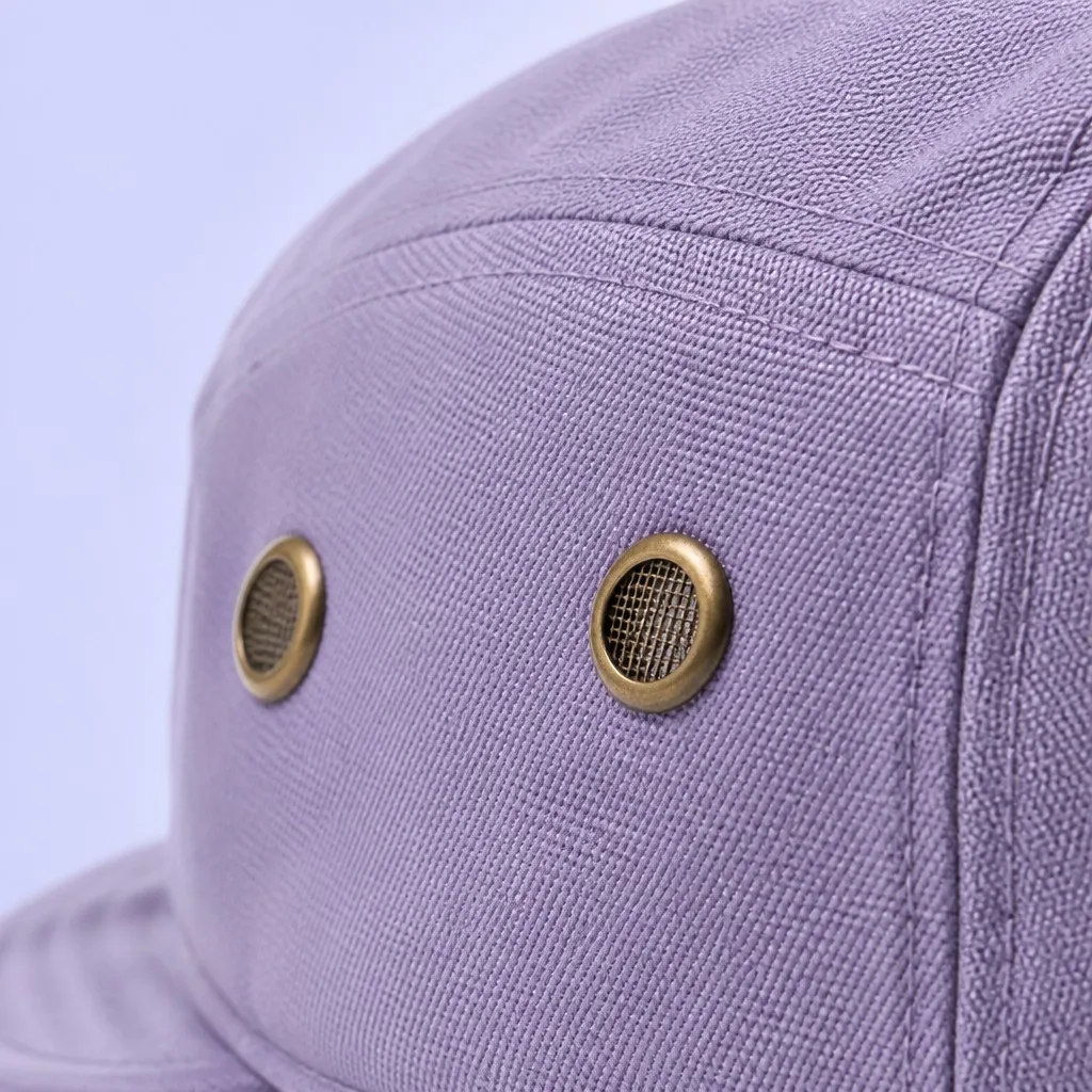 Macro Texture View of Dual Antique Brass Mesh Eyelets on Washed Cotton Twill Side Panel