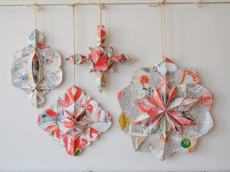 Colorful geometric ornaments made from recycled magazine pages