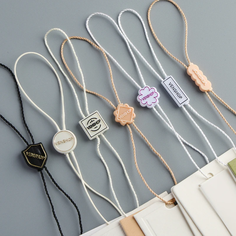 Supplier Customizes Their Own Brand Logo Embossed Fashion Luxury Tag Rope Plastic Hang Tag String Lock Garment Seal