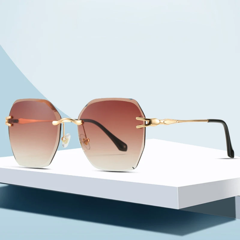 

Wholesale Hot Sale Diamond Sunglasses Fashion Women Metal Rimless Glasses, Picture