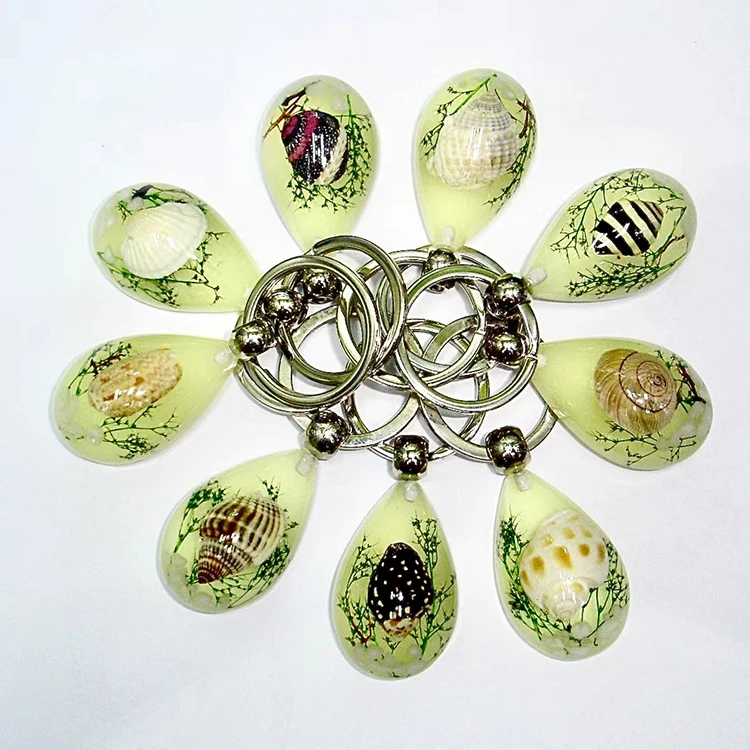 

Factory wholesale luminous seashell acrylic keychain resin kawaii keychain for boys