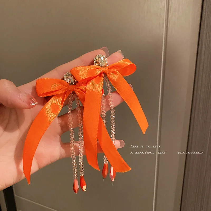 

trendy crystal drop orange fabric bow earrings