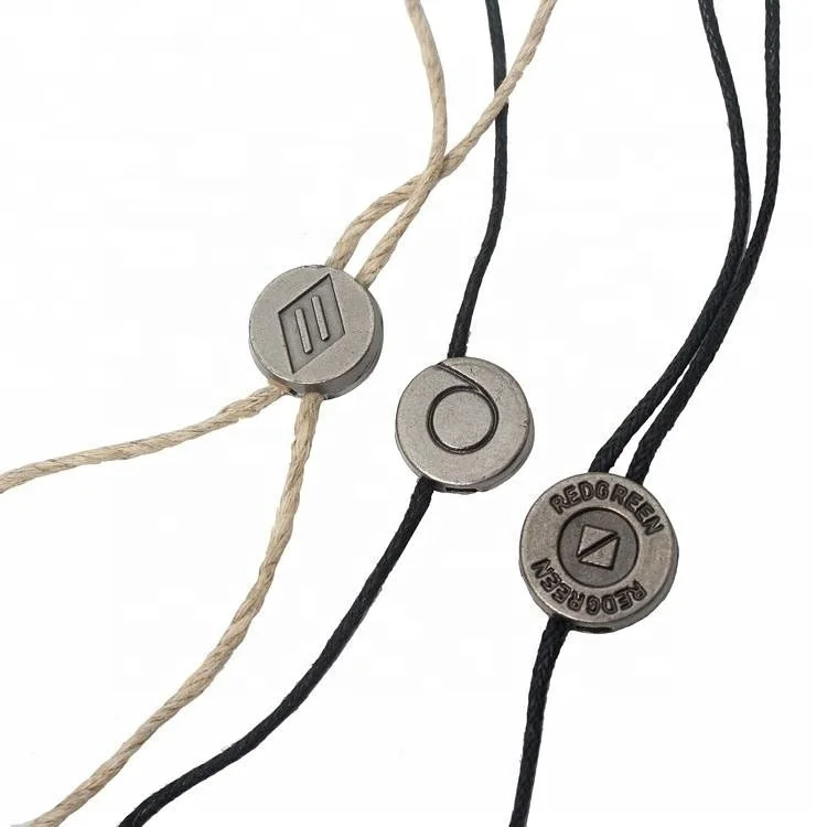 

Custom Double Sided Debossed Logo Metal Hang Tags Strings for Clothing
