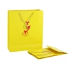 2019 New coated paper packaging , yellow custom size paper bags for shopping store