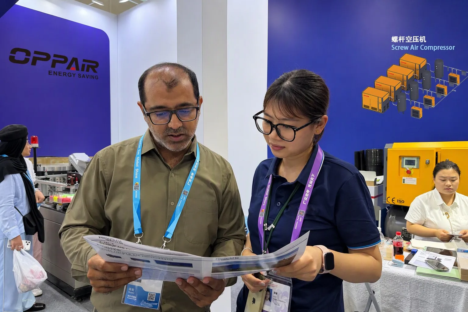 Overseas Client and OPPAIR Specialist Reviewing Product Specifications and Engineering Catalog