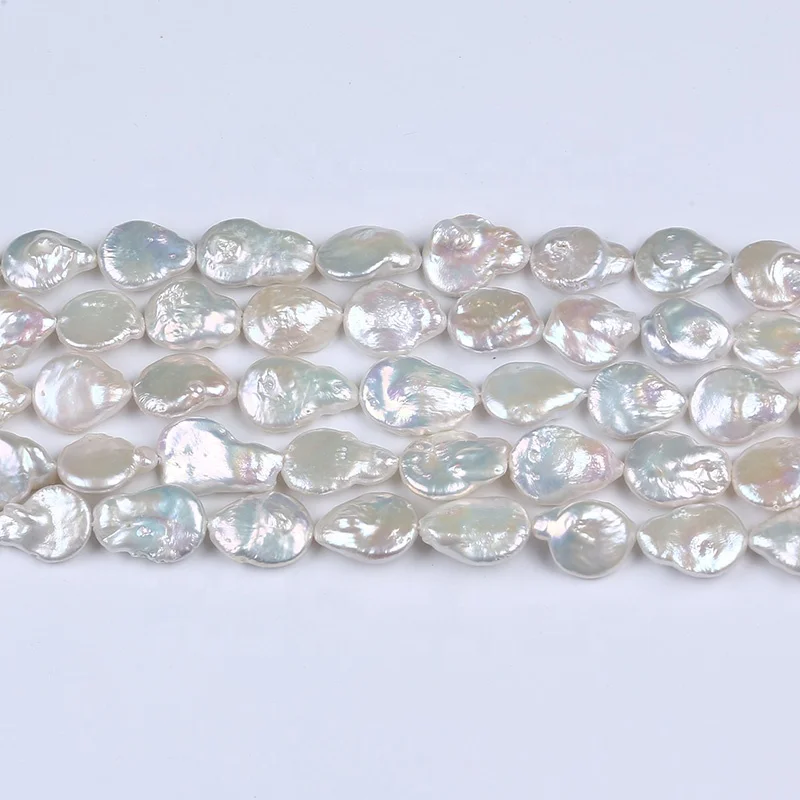 

Natural  A grade white button shape loose beads with tail freshwater pearl strand