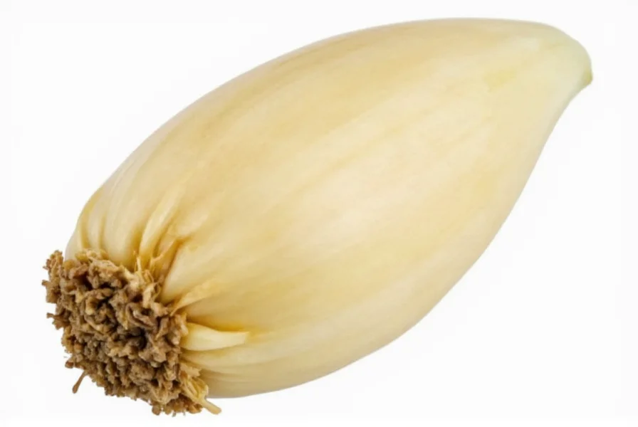 Fresh garlic cloves on wooden cutting board