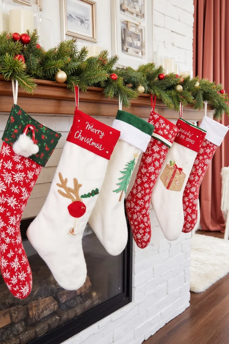 Stocking hanger system mounted above a fireplace