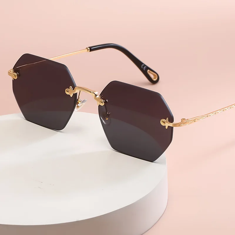 

New sunglasses 2021 brand rimless diamond cut sun glasses men women clear ocean lens metal polygon sunglasses UV400