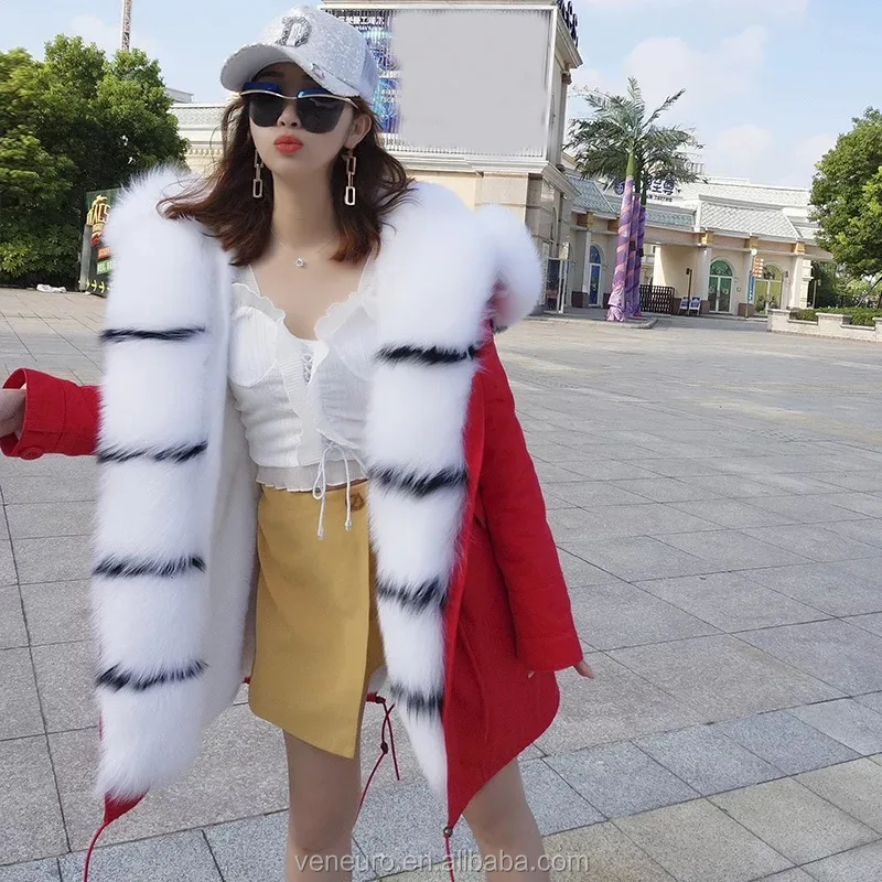 white faux fur coat with red lining