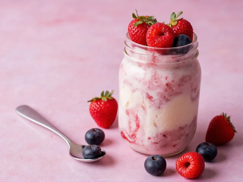 Homemade ice cream in mason jar with fresh berries