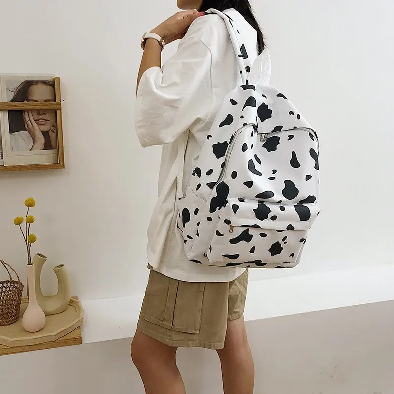 

Custom Cute Graffiti Women Canvas Travel School Bag Teenage Girls Charms Backpack Casual Milk Cow Printing School bags