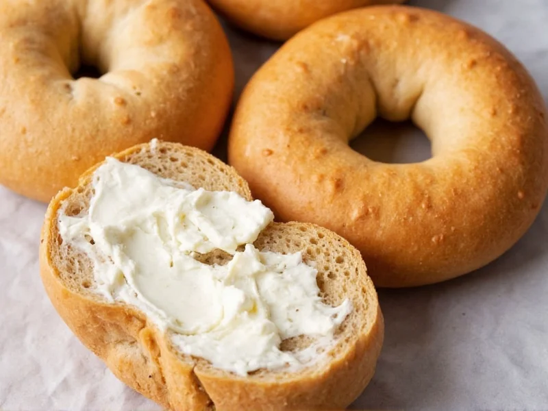 Freshly baked bagels sliced with cream cheese