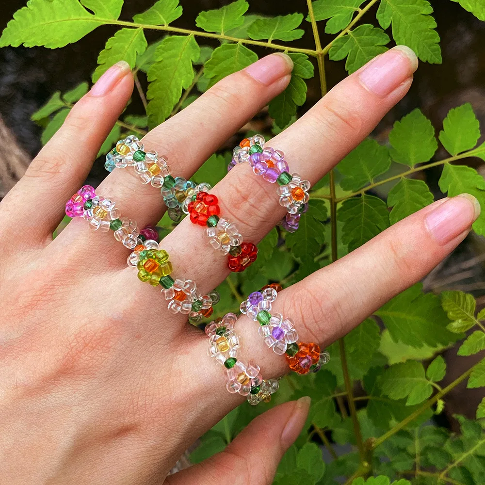 

Wholesale Simple Fashion Beaded Elastic Ring Sweet Candy Color Rice Bead Woven Flower Ring