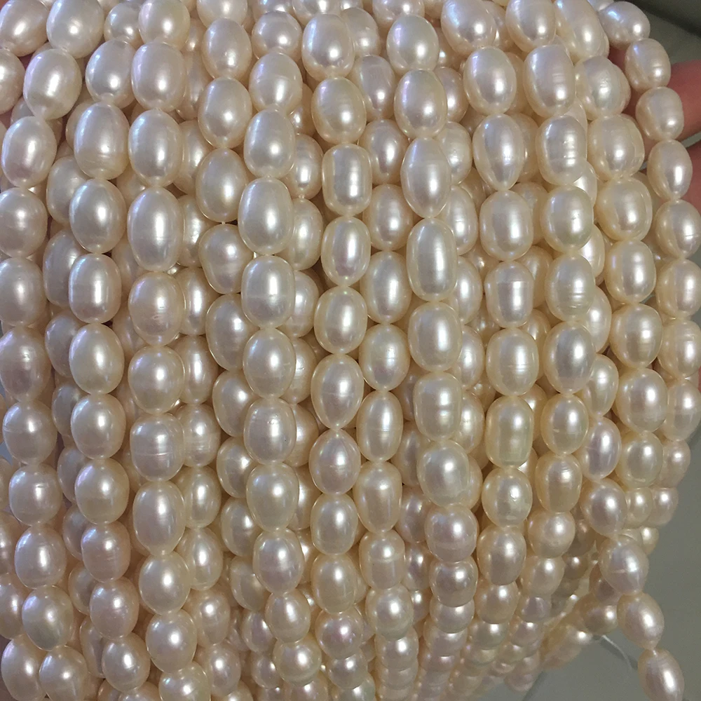 

100% Nature FRESHWATER PEARL7.3-8.3 mm AA grade high quality rice shape pearl in strand loose wholesale freshwater pearl