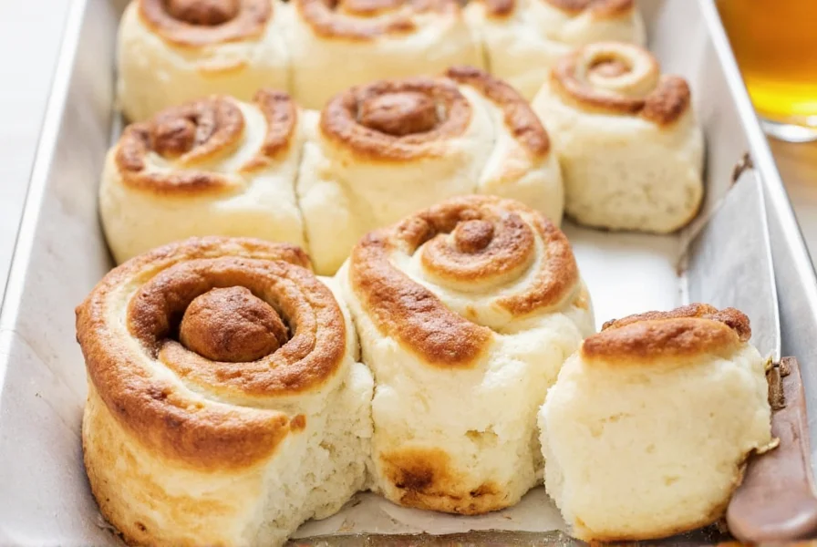 Finished pie crust cinnamon rolls with cream cheese glaze drizzled on top