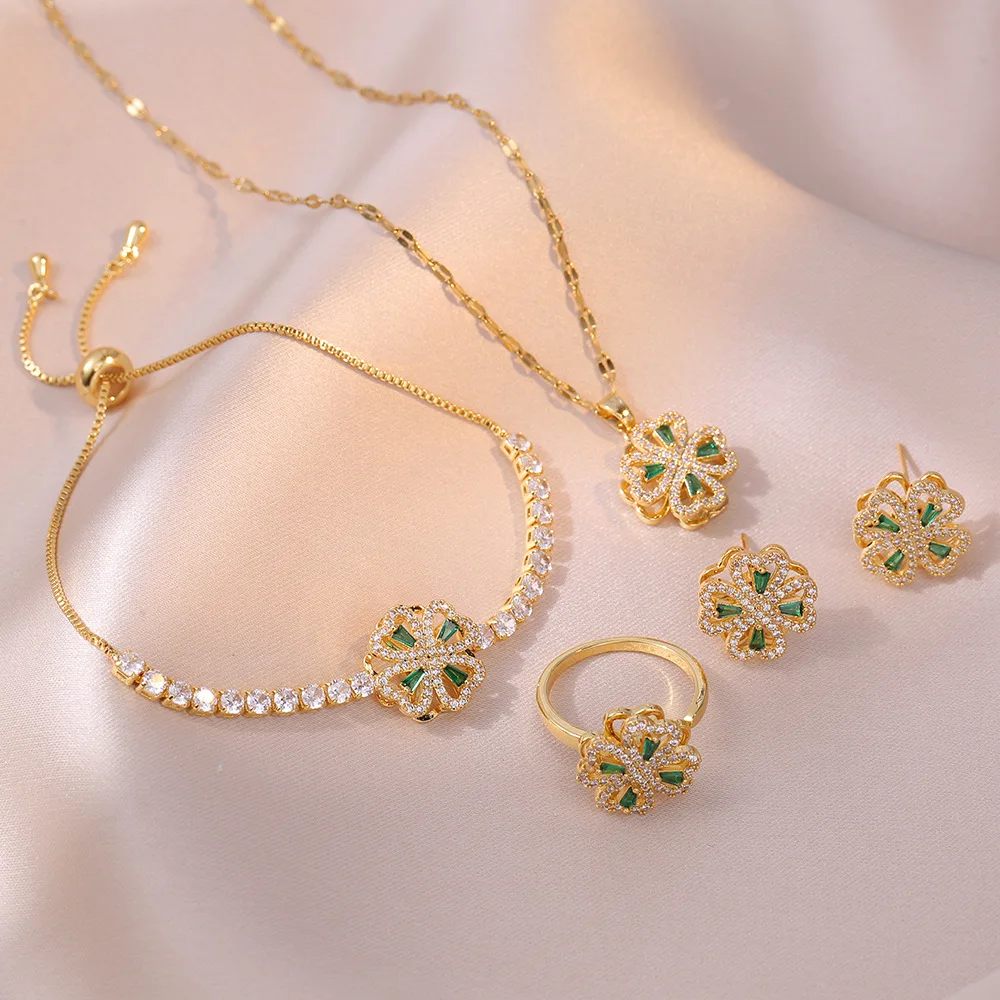 

Hot Selling Inlaid Zircon Jewelry Set Spinner Necklace Bracelet Earrings RingRotatable Four Leaf Clover Jewelry Set For Women