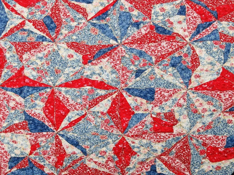 Recycled fabric scrap quilt showing geometric pattern variations