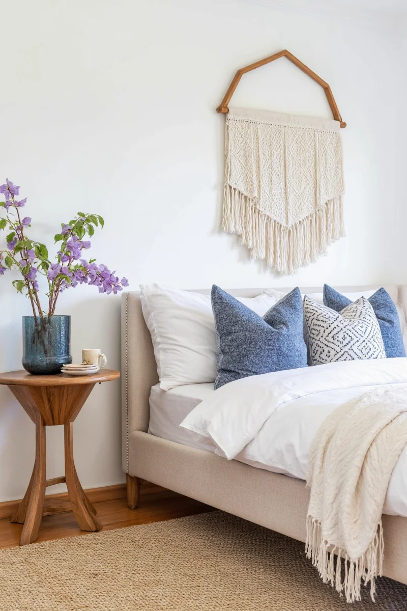 Happy family in a cozy living room decorated with vibrant cushions and kid-safe decor.