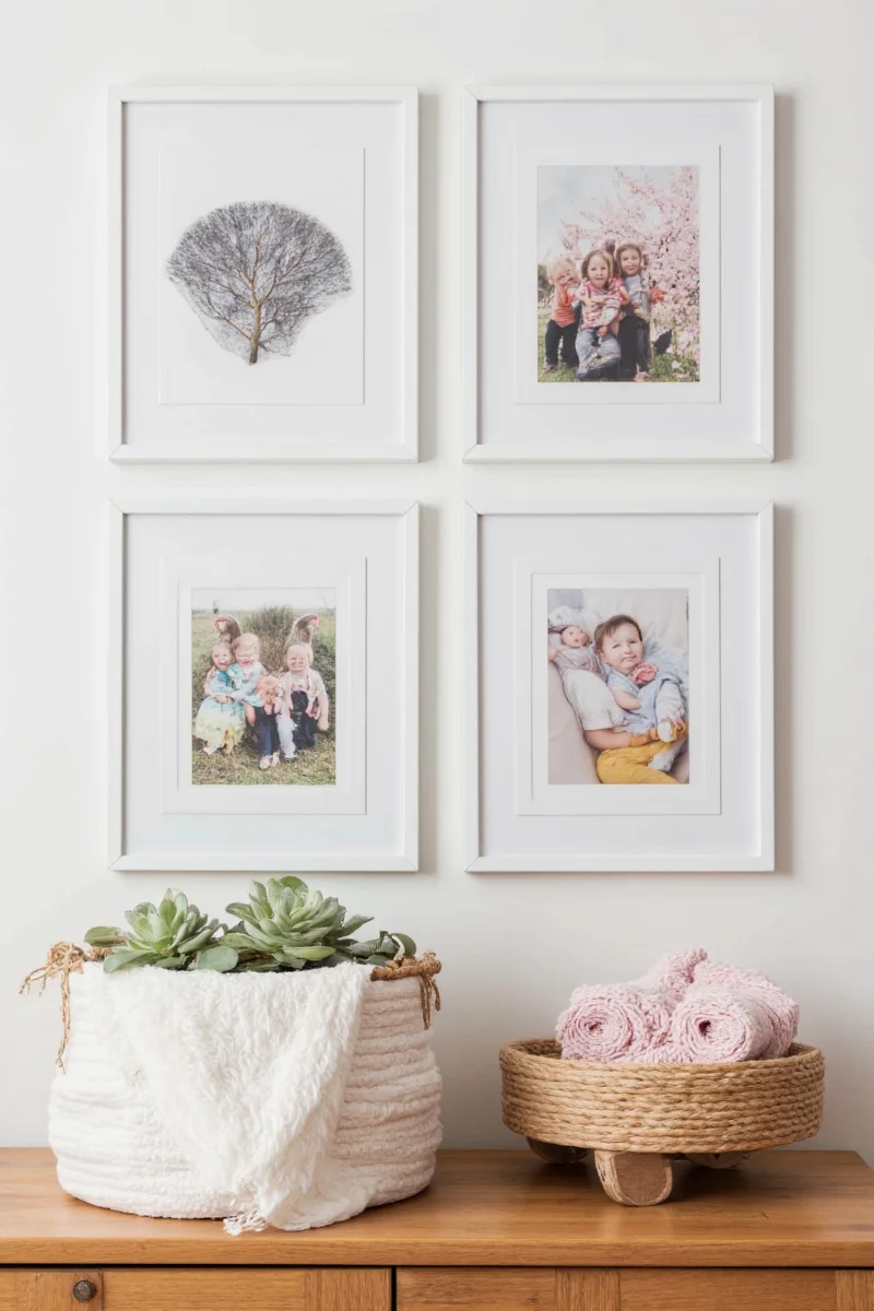 A living room wall covered with kid drawings held up by colorful magnets