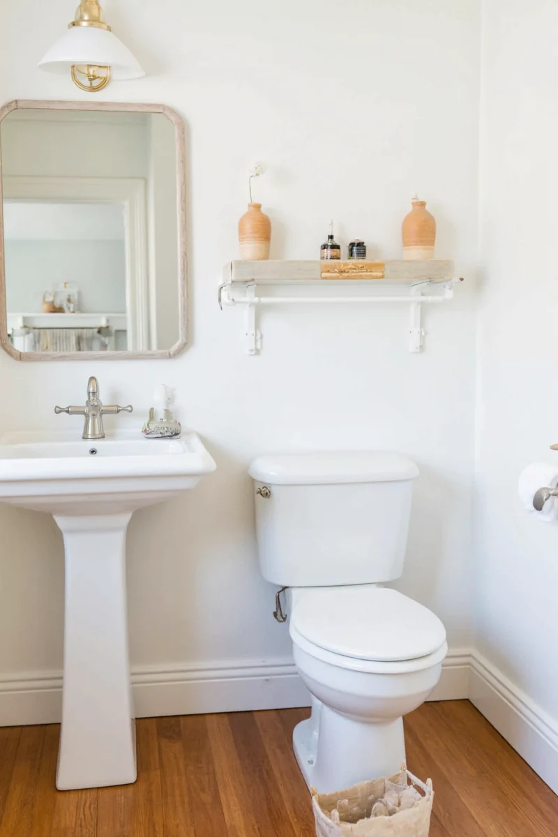 Corner-mounted wall sink saving space in a small bathroom