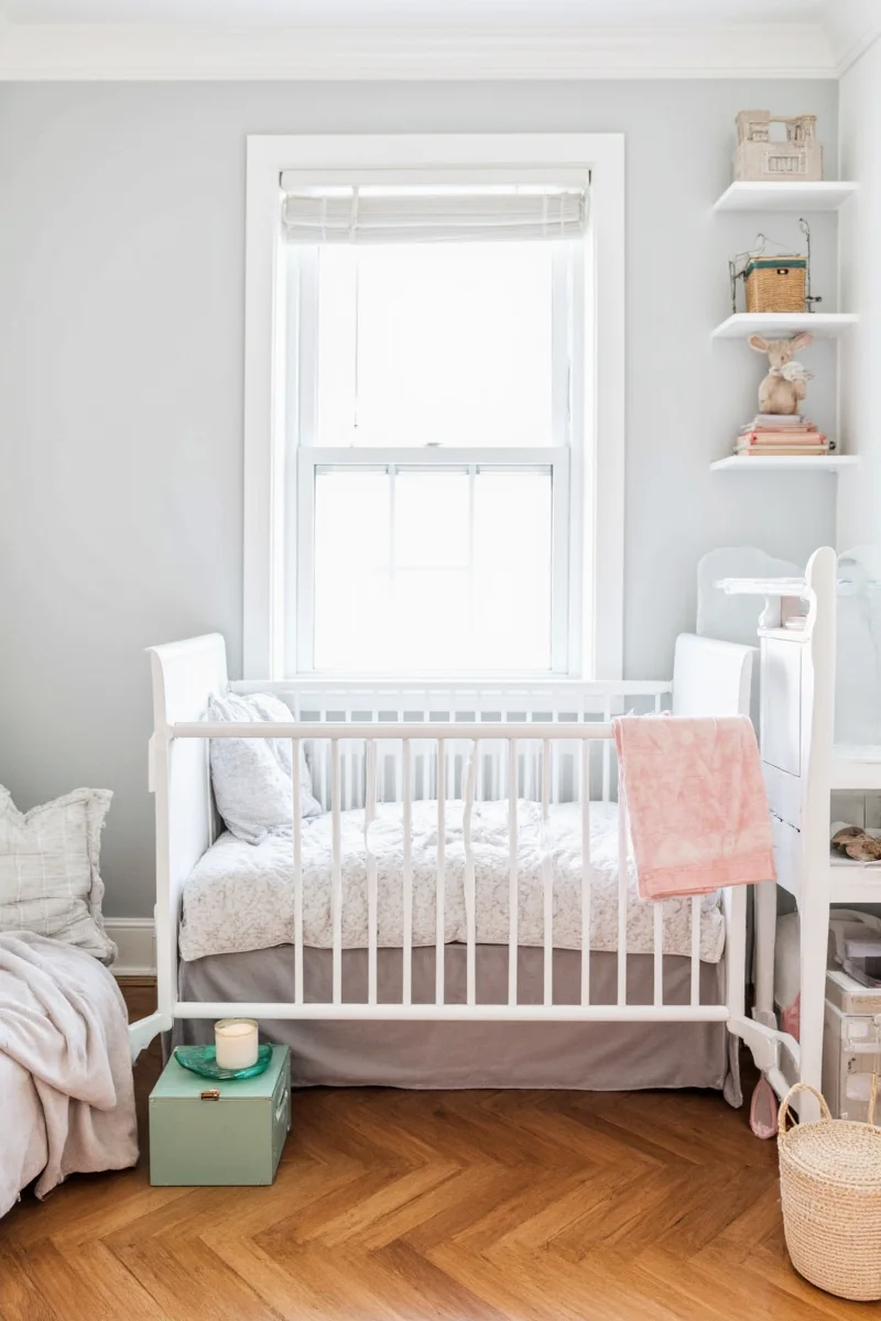 Small nursery with mirror and natural light