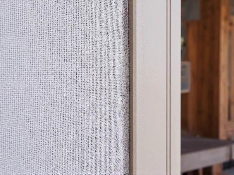 Close-up of screen tension inspection on DIY screened patio