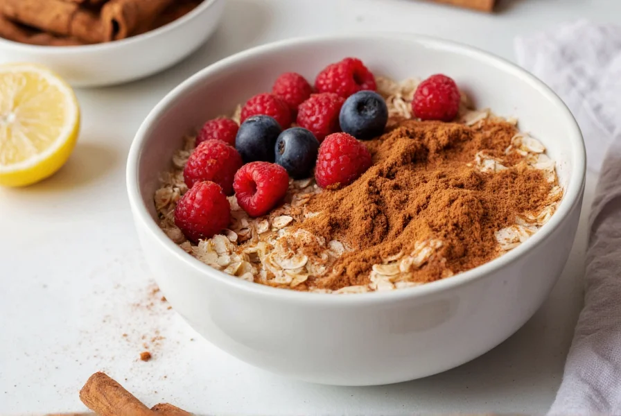Healthy breakfast bowl with oats, berries, and a sprinkle of ground cinnamon, demonstrating practical culinary use of cinnamon