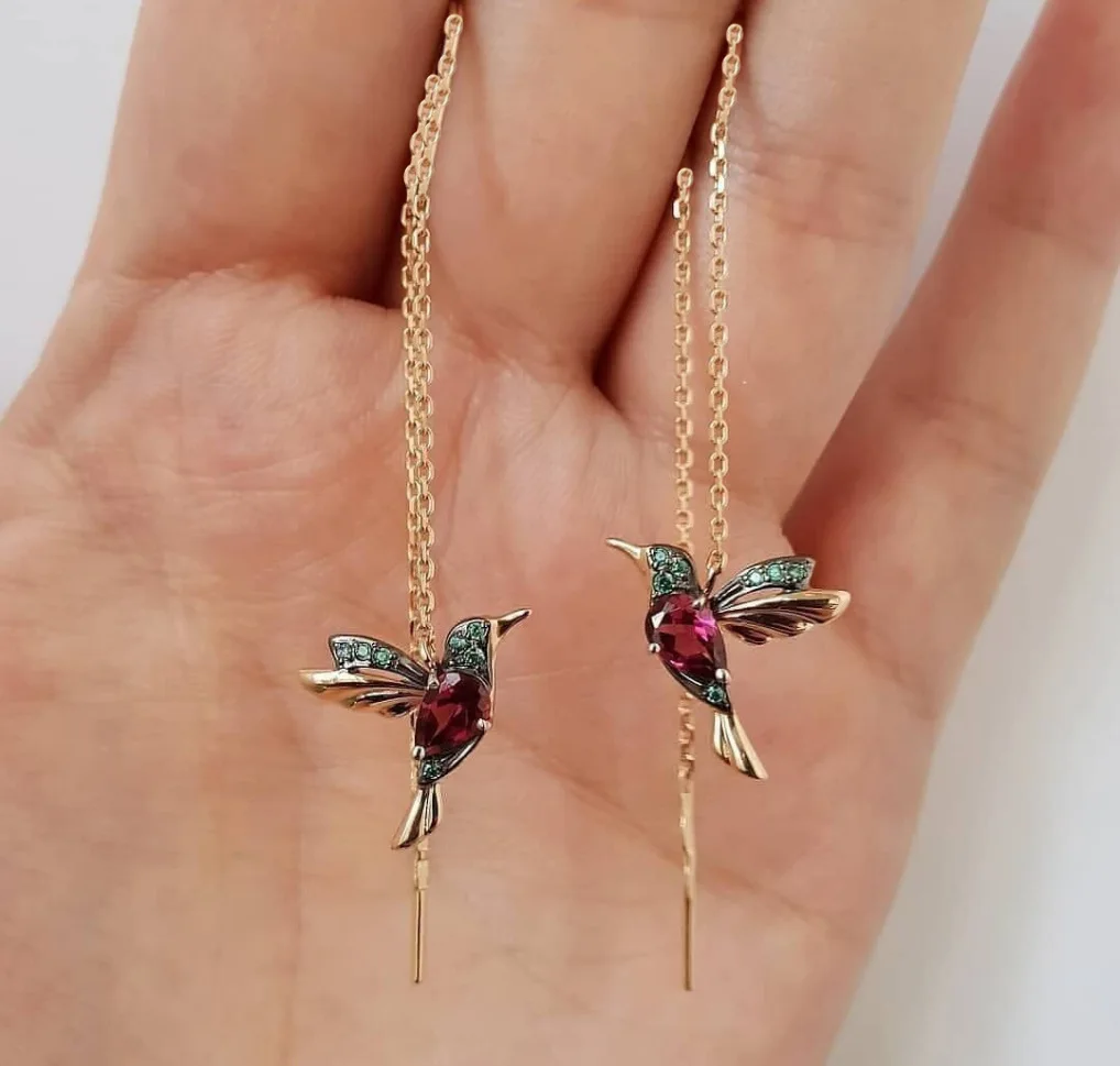 

Manufacturers direct sales hot-selling jewelry red mixed zirconium winged bird earrings.