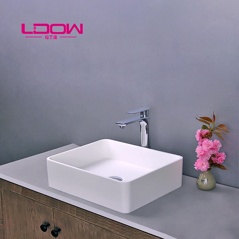 Venta al por mayor corian superficie sólida lavabo del baño-Compre